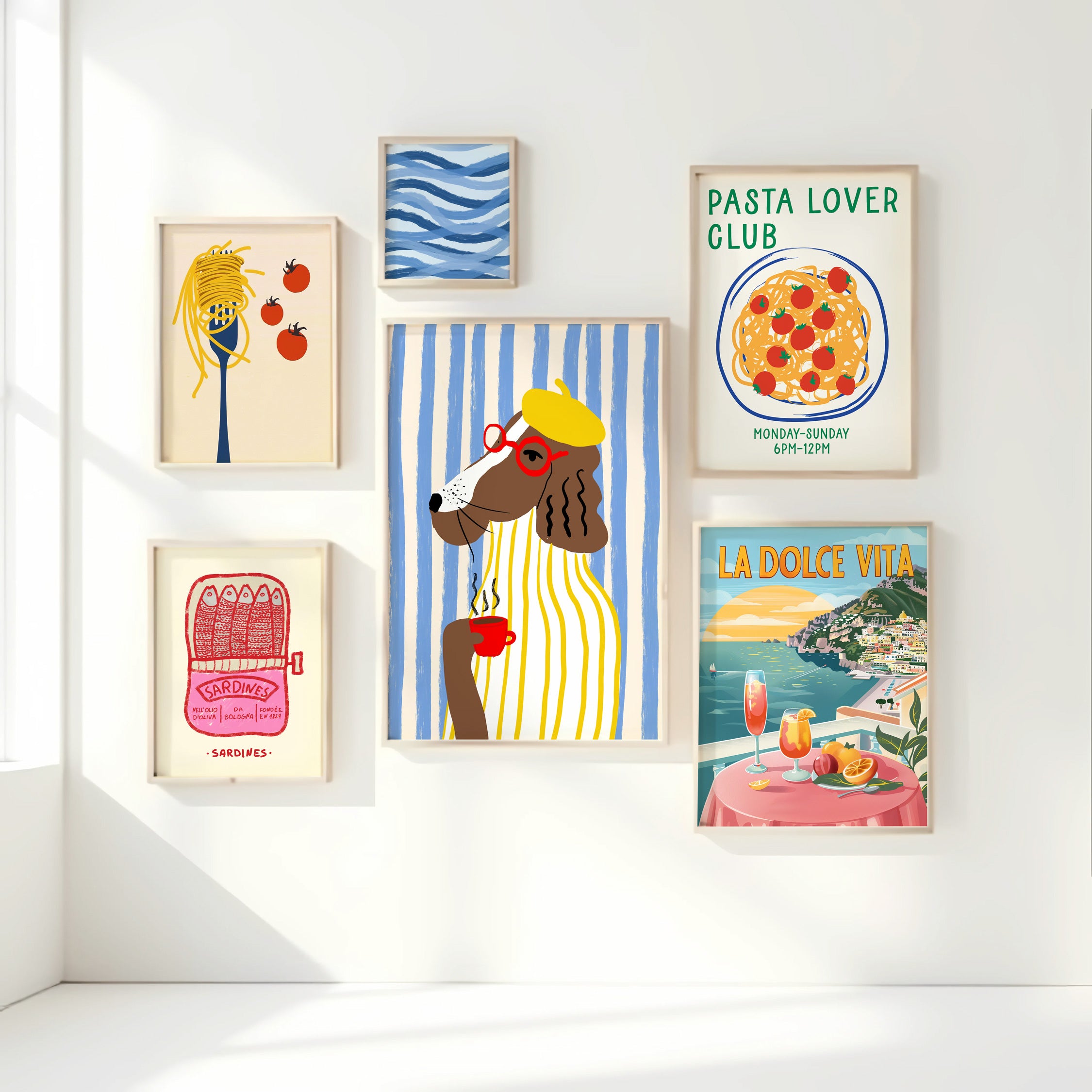 Collection of framed posters on a white wall